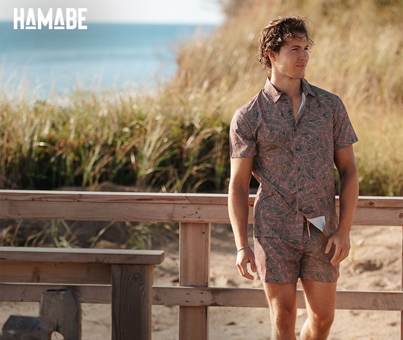 Man wearing a swim set with matching shirt and volley swim shorts, from Hamabe. 