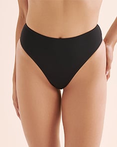 Woman wearing a black bikini bottom