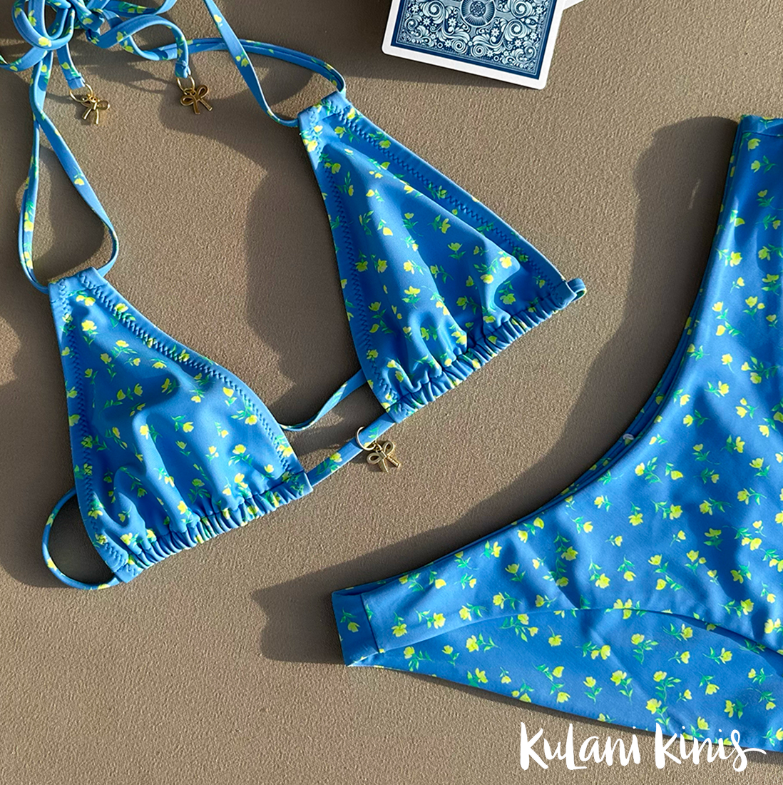 A blue floral Kulani Kinis bikini set layed flat - Bikini Village
