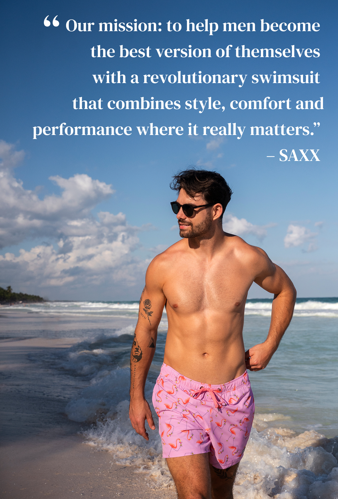 A man wearing a pink volley swimsuit with a flamingo pattern from SAXX – Bikini Village