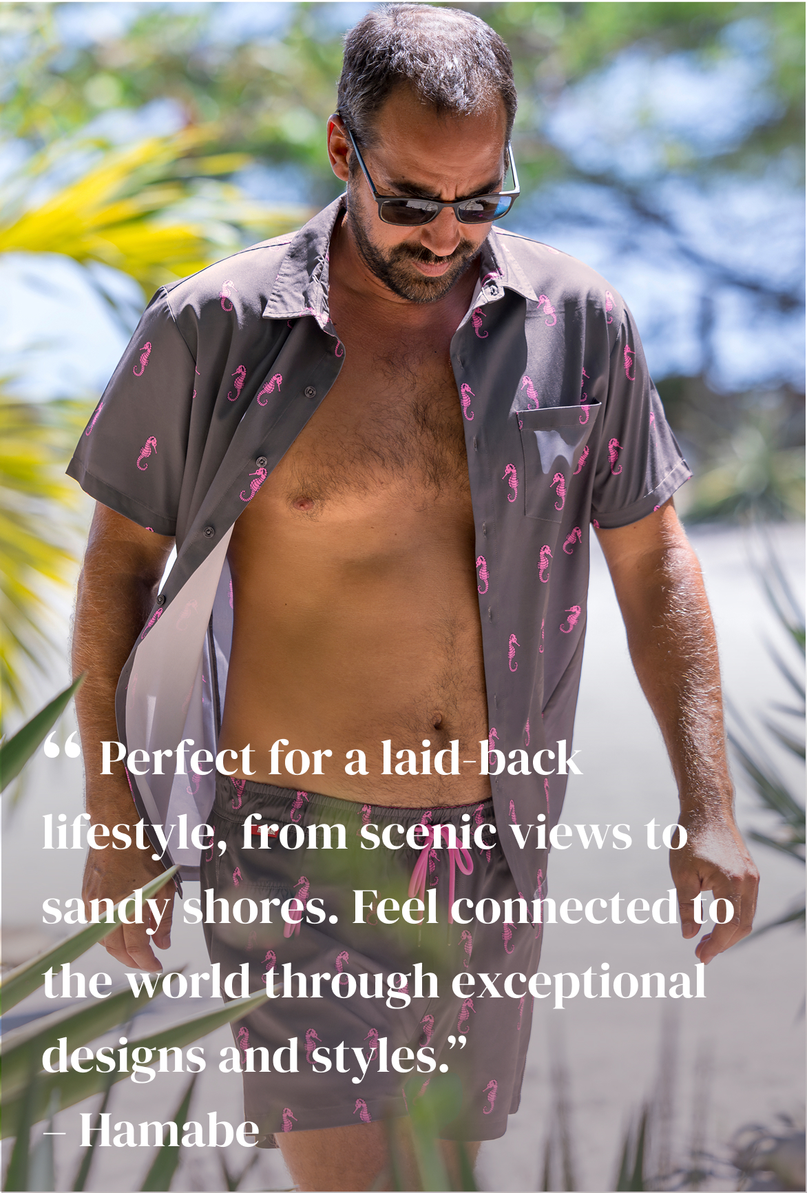 A man wearing a gray and pink Shirt and shorts set from Hamabe - Bikini Village