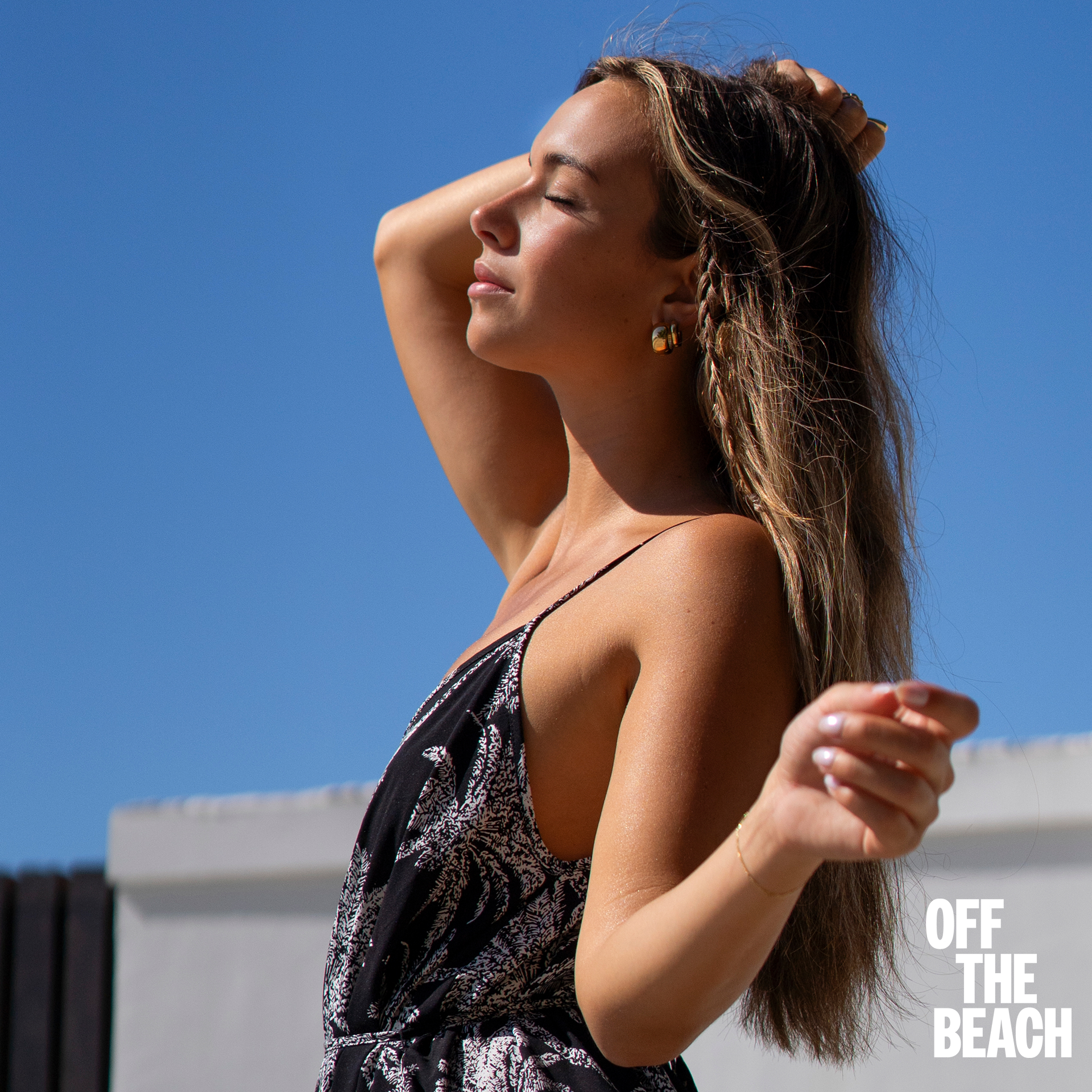 A woman wearing a long sleeveless dress from Off the Beach - Bikini Village